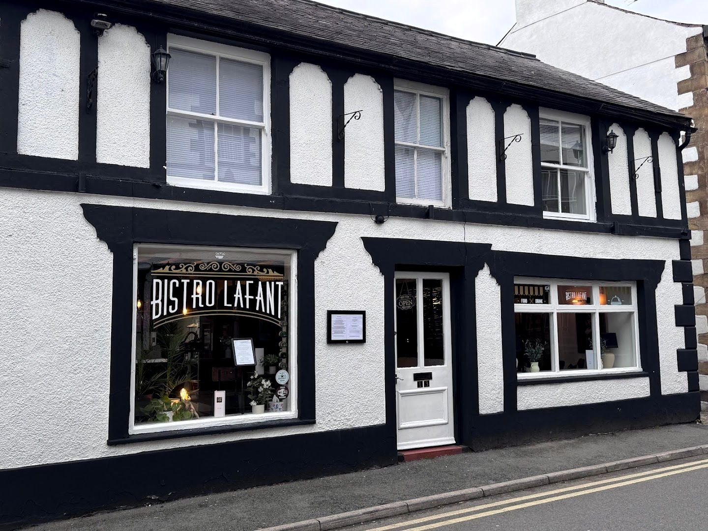 Bistro Lafant on Bridge Street: a black-and-white half-timbered building with the name lettered in white and gold across the front window